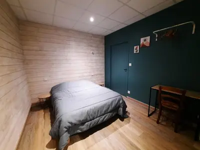 Un ou plusieurs lits dans un hébergement de l'établissement Gîte de charme à la campagne
