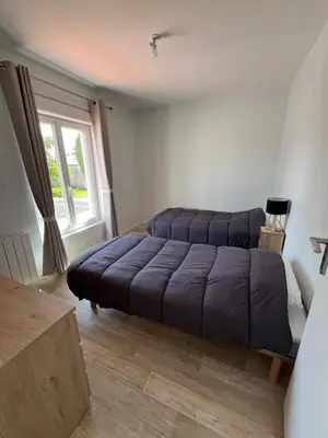 Un ou plusieurs lits dans un hébergement de l'établissement Location maison balnéaire 8 couchages 50m plage du Cormier