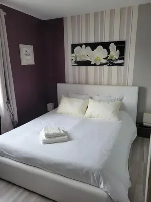 Un ou plusieurs lits dans un hébergement de l'établissement Maison cosy entre mer et Brière