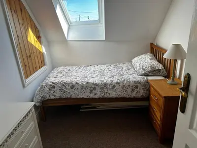 Un ou plusieurs lits dans un hébergement de l'établissement Kastellbriant Cottage