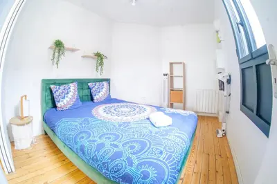 Un ou plusieurs lits dans un hébergement de l'établissement Appartement très lumineux - vue sur la ville - 4 personnes