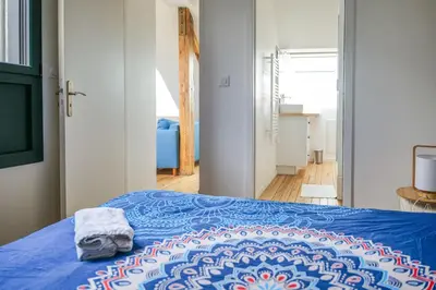 Un ou plusieurs lits dans un hébergement de l'établissement Appartement très lumineux - vue sur la ville - 4 personnes