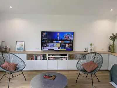 Télévision ou salle de divertissement dans l'établissement Agréable dépendance !