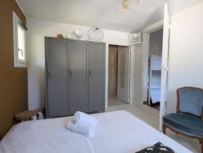 Un ou plusieurs lits dans un hébergement de l'établissement Esprit vacances entre jardin & plage du Porteau