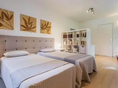 Un ou plusieurs lits dans un hébergement de l'établissement Gîte Contemporain avec Jardin et Parking à La Chapelle-sur-Erdre - FR-1-306-1309
