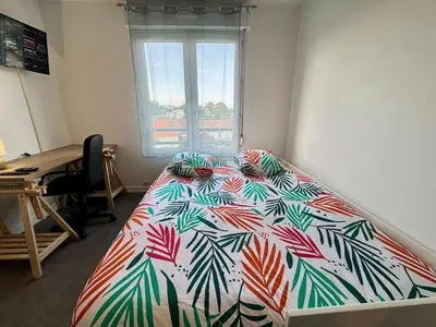 Un ou plusieurs lits dans un hébergement de l'établissement Appartement Cosy dans le Centre
