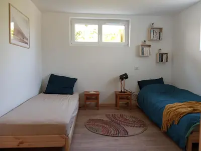 Un ou plusieurs lits dans un hébergement de l'établissement L'Olivier, appartement cosy entre mer et forêt