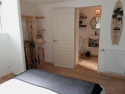 Un ou plusieurs lits dans un hébergement de l'établissement L'Olivier, appartement cosy entre mer et forêt