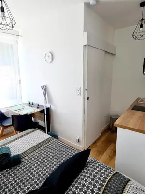 Un ou plusieurs lits dans un hébergement de l'établissement Studio 1 Cozy en centre-ville - Puy duFou
