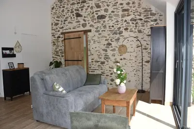 Coin salon dans l'établissement L'Escapade du Crezou
