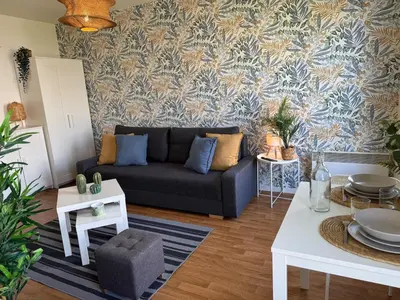 Coin salon dans l'établissement Bienvenue dans la jungle - Proche Parc et Commodités & Wifi