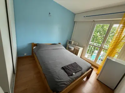 Un ou plusieurs lits dans un hébergement de l'établissement 4 bedroom apartment