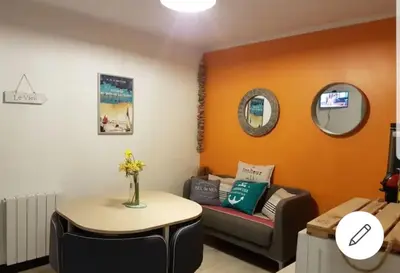 Coin salon dans l'établissement Les Lauriers Roses