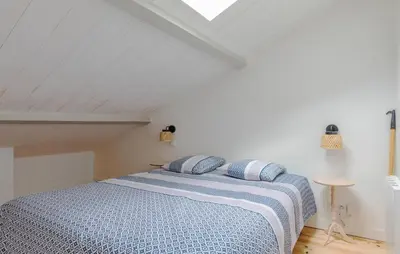 Un ou plusieurs lits dans un hébergement de l'établissement Charmante Maison Proche Mer