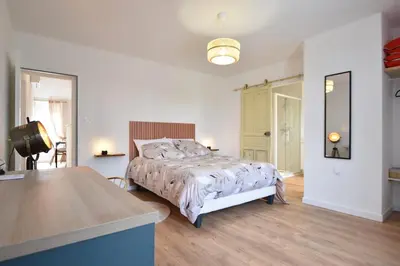 Un ou plusieurs lits dans un hébergement de l'établissement Cozy appartement