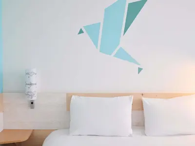 Un ou plusieurs lits dans un hébergement de l'établissement Greet Hôtel Saint-Nazaire Trignac Nouvelle Marque du Groupe Accor