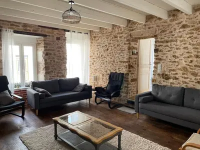 Coin salon dans l'établissement Charmante maison de village 30 min Puy DuFou