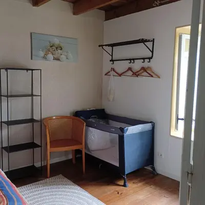 Un ou plusieurs lits dans un hébergement de l'établissement Charmante maison de village 30 min Puy DuFou