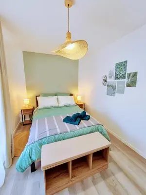 Un ou plusieurs lits dans un hébergement de l'établissement Appartement 