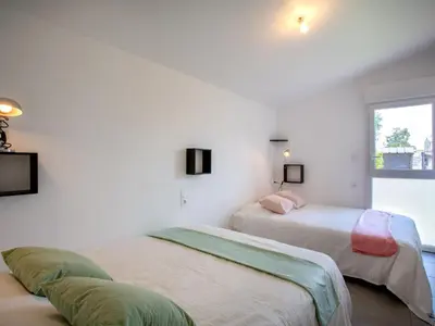 Un ou plusieurs lits dans un hébergement de l'établissement Holiday Home L'Effet Mer by Interhome