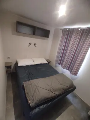 Un ou plusieurs lits dans un hébergement de l'établissement Sol à gogo 3 Chambres à 50 m de la plage