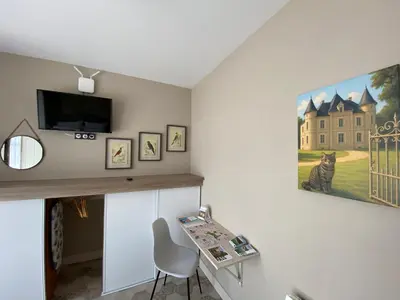 Télévision ou salle de divertissement dans l'établissement L'Orangerie