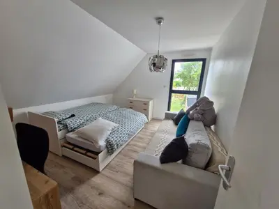 Un ou plusieurs lits dans un hébergement de l'établissement VILLA Plage&Piscine&Lac
