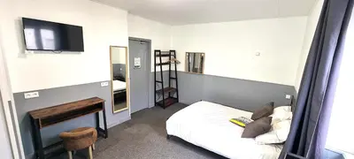 Un ou plusieurs lits dans un hébergement de l'établissement hôtel BEAUTOUR