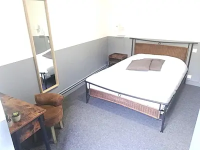 Un ou plusieurs lits dans un hébergement de l'établissement hôtel BEAUTOUR