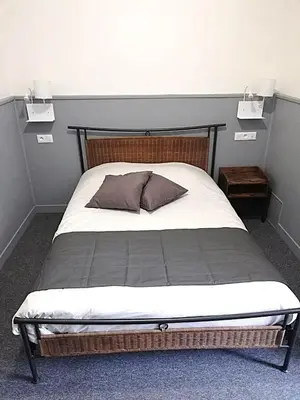 Un ou plusieurs lits dans un hébergement de l'établissement hôtel BEAUTOUR