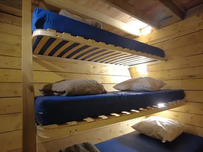 Un ou plusieurs lits dans un hébergement de l'établissement La Maison Magique