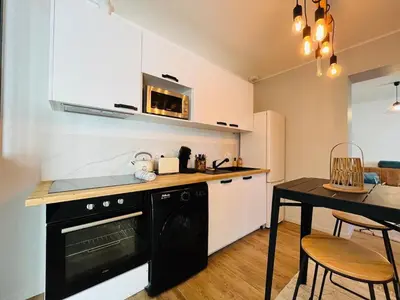Cuisine ou kitchenette dans l'établissement Casa Belfort - T2