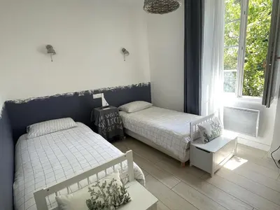 Un ou plusieurs lits dans un hébergement de l'établissement Maison charmante près de la plage avec WIFI, au cœur de Saint-Jean-de-Monts - FR-1-652-60