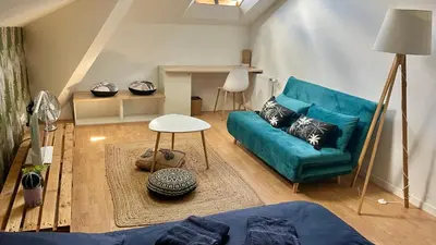 Coin salon dans l'établissement Chambre dans colocation Cholet Centre