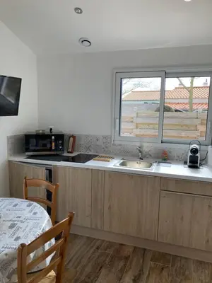 Cuisine ou kitchenette dans l'établissement Le Clos qui Clôt