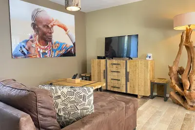 Télévision ou salle de divertissement dans l'établissement Villa Tanzanie - Domaine Le Sherwood