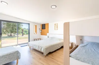 Un ou plusieurs lits dans un hébergement de l'établissement Gîte Honorus - SPA - Puy duFou - Grande capacité