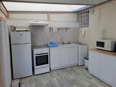 Cuisine ou kitchenette dans l'établissement Location vacances