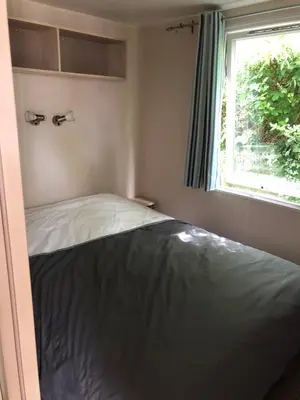 Un ou plusieurs lits dans un hébergement de l'établissement Mobilhome 3 chambres camping 4 étoiles