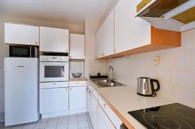 Cuisine ou kitchenette dans l'établissement Le Delezir - Wifi - Balcon - Plage