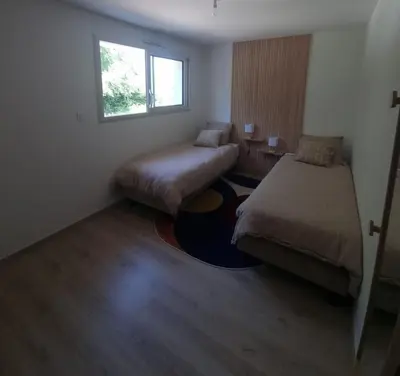 Un ou plusieurs lits dans un hébergement de l'établissement Maison Cosy T4 proche de la mer
