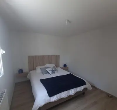 Un ou plusieurs lits dans un hébergement de l'établissement Maison Cosy T4 proche de la mer