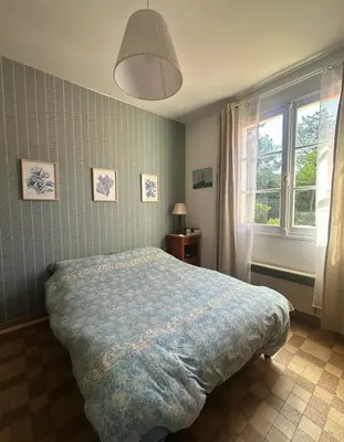 Un ou plusieurs lits dans un hébergement de l'établissement Maison bord de plage