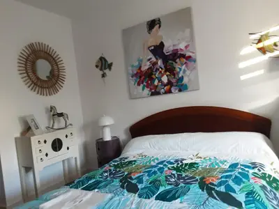Un ou plusieurs lits dans un hébergement de l'établissement VILLA 5 CHAMBRES 10 PERSONNES 300m PLAGE DEMOISELLE