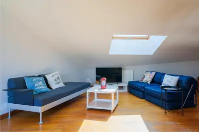 Coin salon dans l'établissement Les Flots - Wi-Fi, TV, Garages, Central