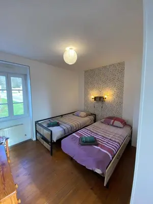 Un ou plusieurs lits dans un hébergement de l'établissement Gîte les Herbiers