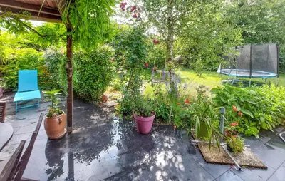 Jardin de l'établissement Charmante Maison En Vendée