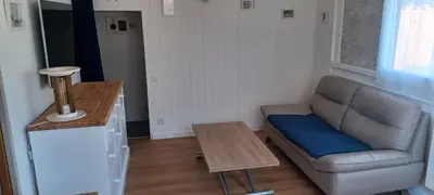 Coin salon dans l'établissement CHALET en bois à 600 m de la plage