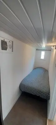 Un ou plusieurs lits dans un hébergement de l'établissement CHALET en bois à 600 m de la plage