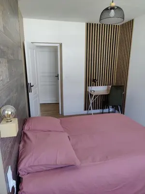 Un ou plusieurs lits dans un hébergement de l'établissement T4 coeur de ville, à deux pas de la plage - 3 chambres